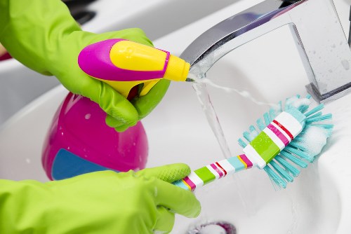 Commercial cleaners maintaining a tidy office workspace
